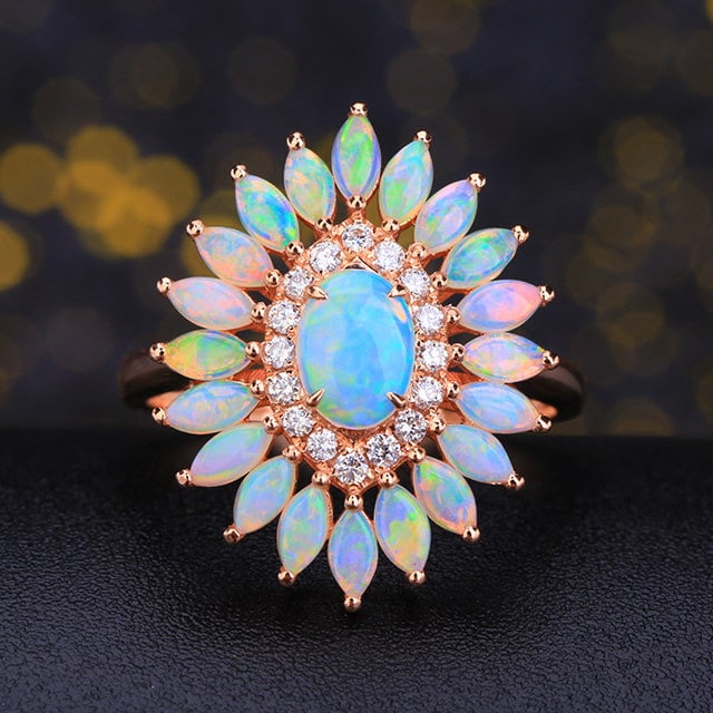 14k Gold 1.43 Ctw Natural Opal & Opal Ring: Ref:231186236 // gold content:14k gold // ring size:7. 25us // // main gemstone:opal // shape:oval // carat weight:0. 39ct // color:white // treatment:natural // // adjacent gemstone 2 : opal // shape