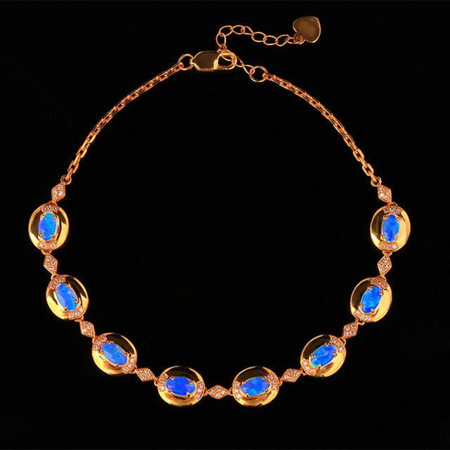 14k Gold 1.49 Ctw Natural Opal & Diamond Bracelet: Ref:231186237 // gold content:14k gold // main gemstone:opal // shape:oval // carat weight:1. 24ct // color:white // treatment:natural // // adjacent gemstone 2 : diamond // number of stones:84 //