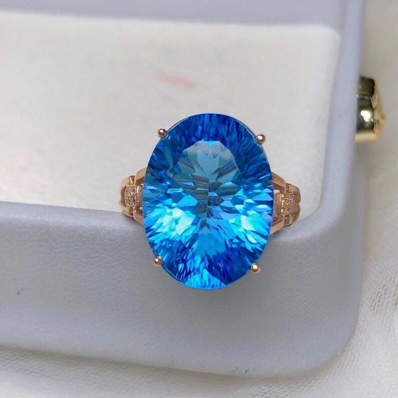14k Gold 12.80 Ct Natural Topaz & Diamond Ring: Ref:231186417 // gold content:14k gold // ring size:7. 25us // // main gemstone:topaz // shape:oval // carat weight:12. 80ct // color:blue // treatment:natural // // adjacent gemstone 2 : diamond // n