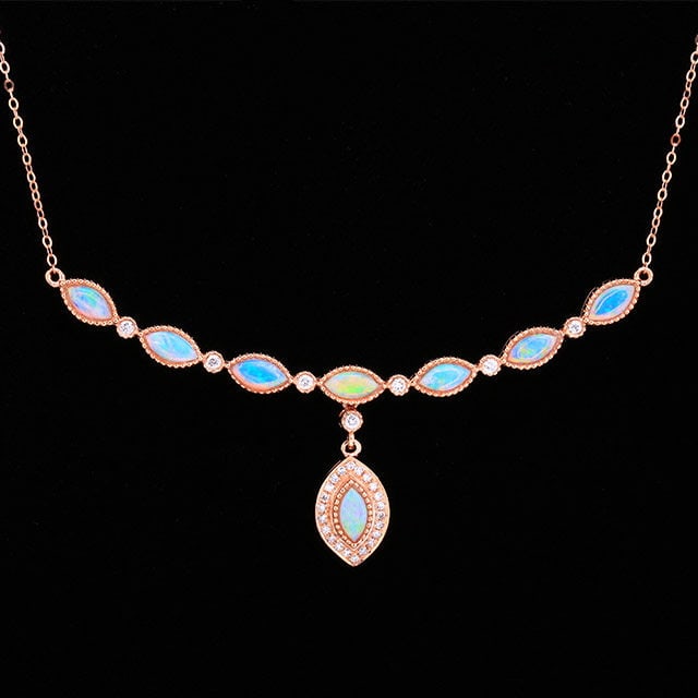 14k Gold 0.79 Ctw Natural Opal & Diamond Necklace: Ref:231187006 // gold content:14k gold // main gemstone:opal // shape:marquise // carat weight:0. 66ct // color:white // treatment:natural // // adjacent gemstone 2 : diamond // number of stones:29 //