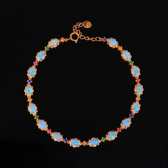 14k Gold 2.78 Ctw Natural Opal & Diamond Bracelet: Ref:231187007 // gold content:14k gold // main gemstone:opal // shape:oval // carat weight:2. 4ct // color:white // treatment:natural // // adjacent gemstone 2 : diamond // number of stones:128 // sha