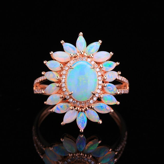 14k Gold 1.80 Ctw Natural Opal & Opal Ring: Ref:231187008 // gold content:14k gold // ring size:7. 25us // // main gemstone:opal // shape:oval // carat weight:0. 69ct // color:white // treatment:natural // // adjacent gemstone 2 : opal // shape