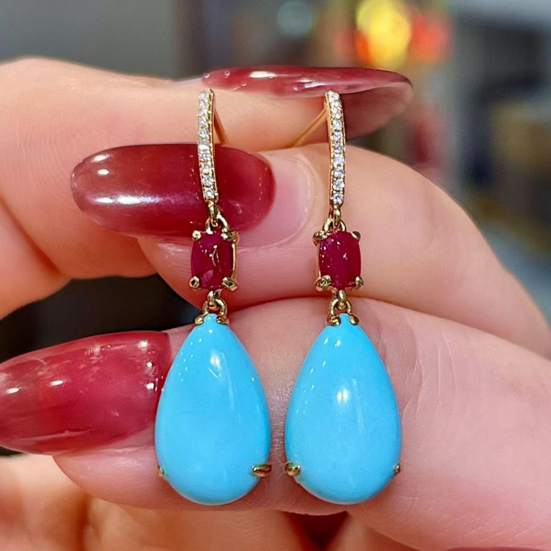 14k Gold 5.41 Ctw Natural Blue Turquoise & Ruby Earrings: Ref:231187123 // gold content:14k gold // main gemstone:blue turquoise // shape:pear // carat weight:4. 98ct // color:blue // treatment:natural // // adjacent gemstone 2 : ruby // shape:sugar-loaf //