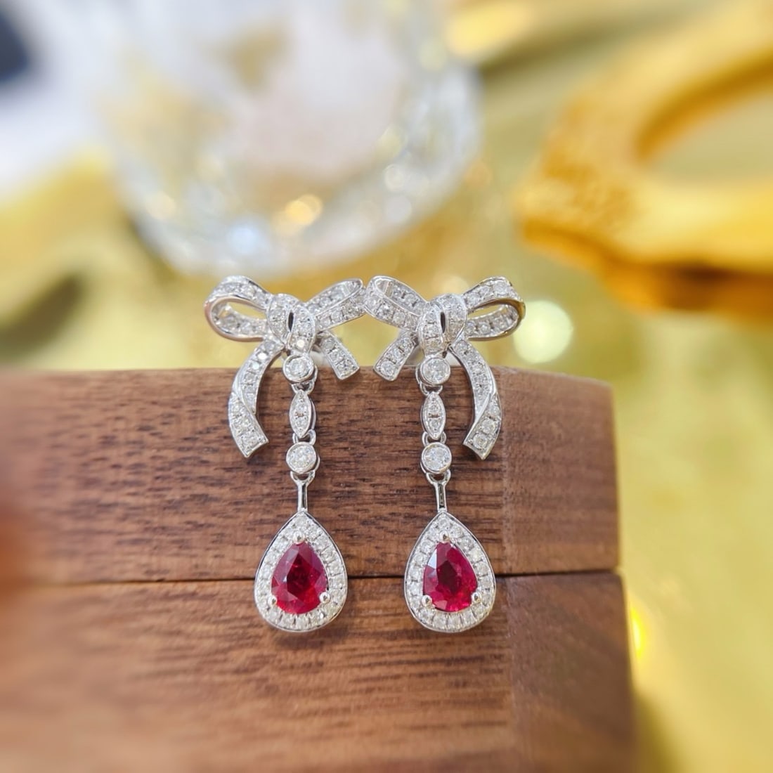 14k Gold 0.92 Ctw Natural Ruby & Diamond Earrings: Ref:231187202 // gold content:14k gold // main gemstone:ruby // shape:pear // carat weight:0. 52ct // color:red // treatment:natural // // adjacent gemstone 2 : diamond // shape:round // carat
