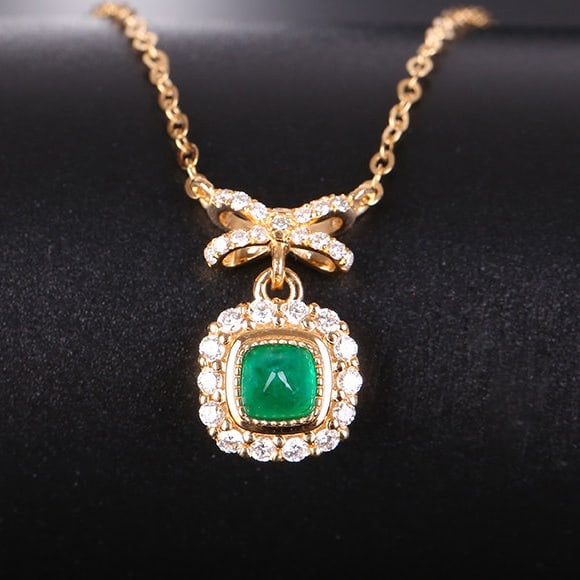 14k Gold 0.78 Ctw Natural Emerald & Diamond Necklace: Ref:231187203 // gold content:14k gold // main gemstone:emerald // shape:sugar-loaf // carat weight:0. 5ct // color:green // treatment:natural // // adjacent gemstone 2 : diamond // shape:round //