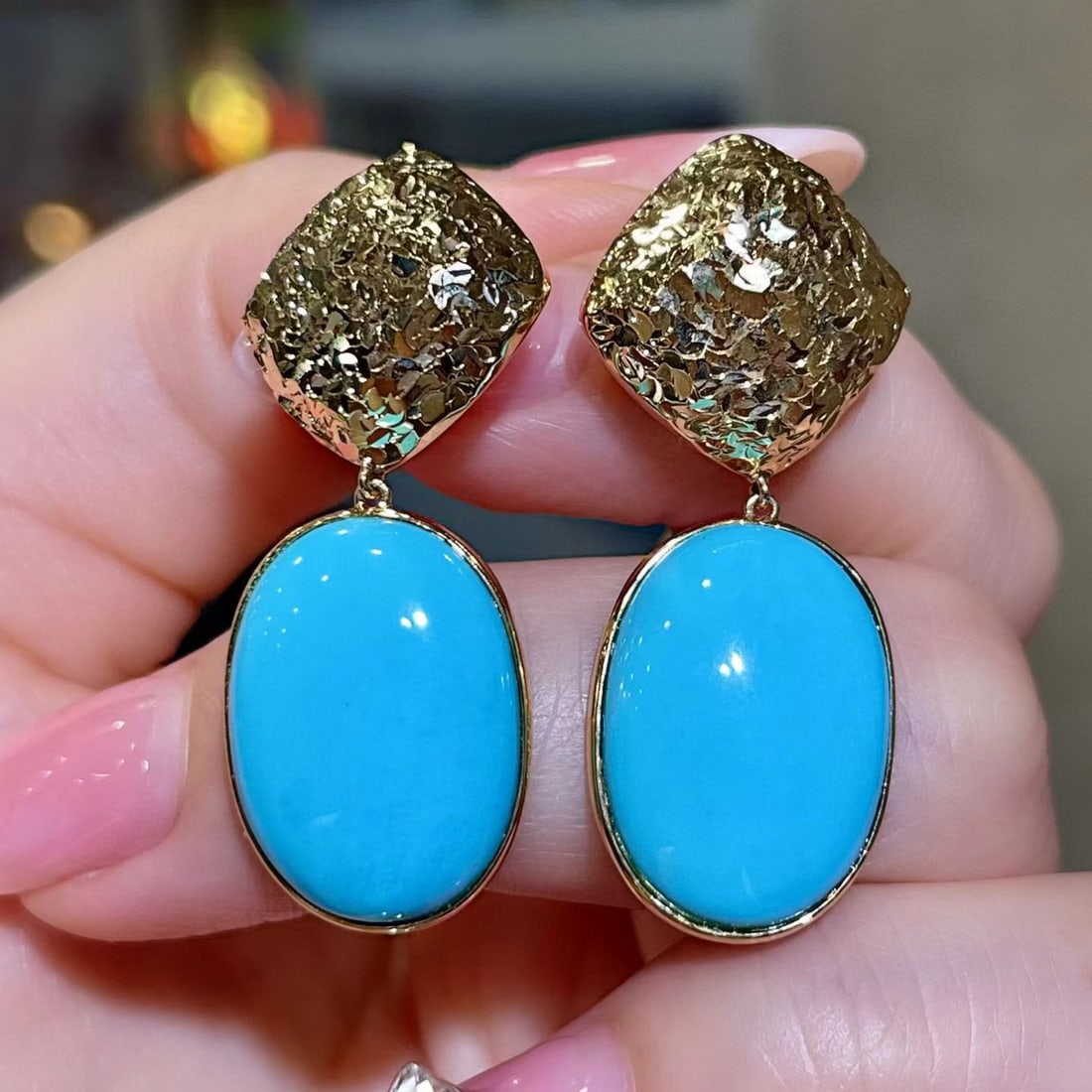 14k Gold 16.6 Ct Natural Blue Turquoise Earrings: Ref:231187219 // gold content:14k gold // main gemstone:blue turquoise // shape:oval // carat weight:16. 6ct // color:blue // treatment:natural // Condition: New Low Estimate: 10000.00 High Estimate: