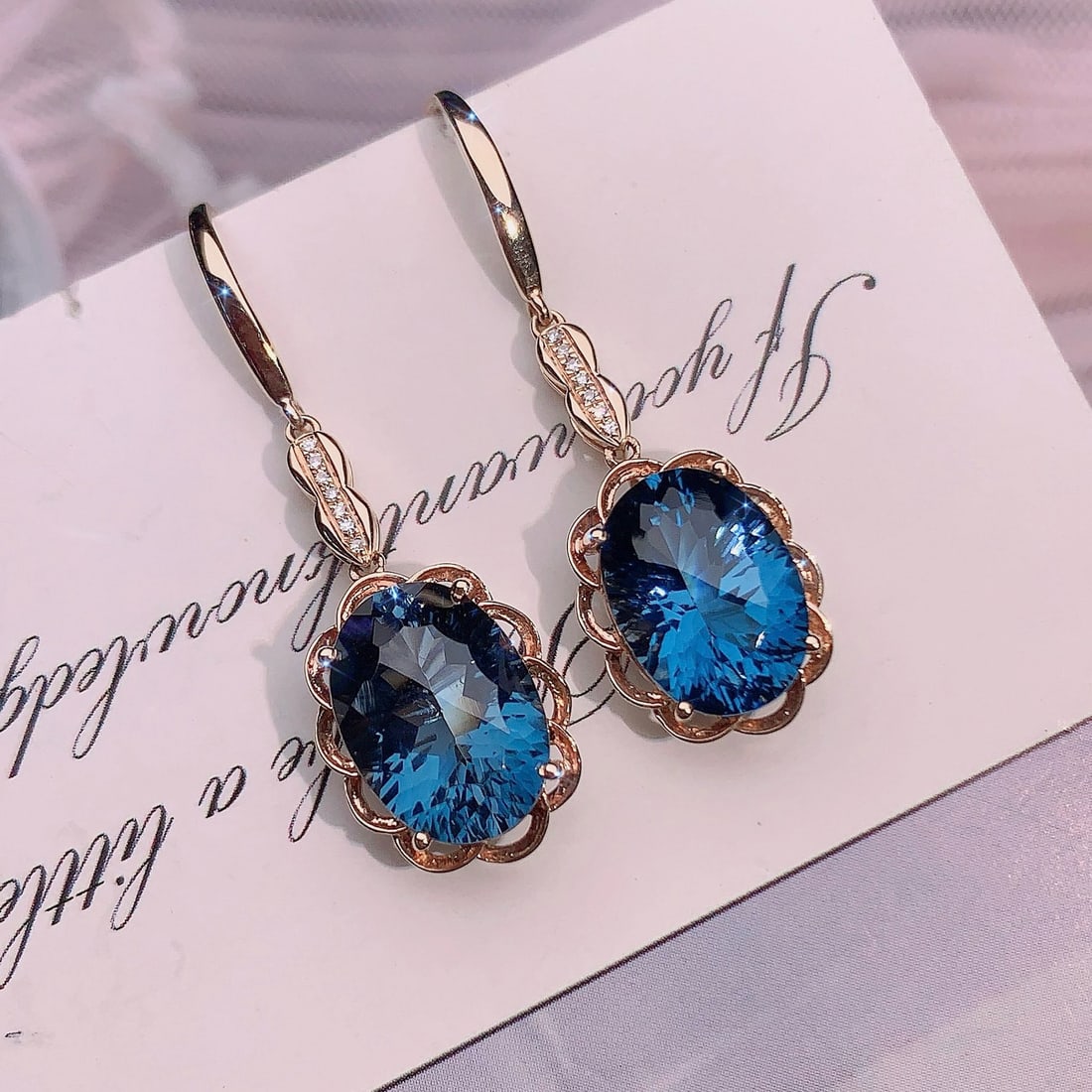 14k Gold 9.29 Ctw Natural Topaz & Diamond Earrings: Ref:231188014 // gold content:14k gold // main gemstone:topaz // shape:oval // carat weight:9. 25ct // color:blue // treatment:natural // // adjacent gemstone 2 : diamond // number of stones:14 // sha