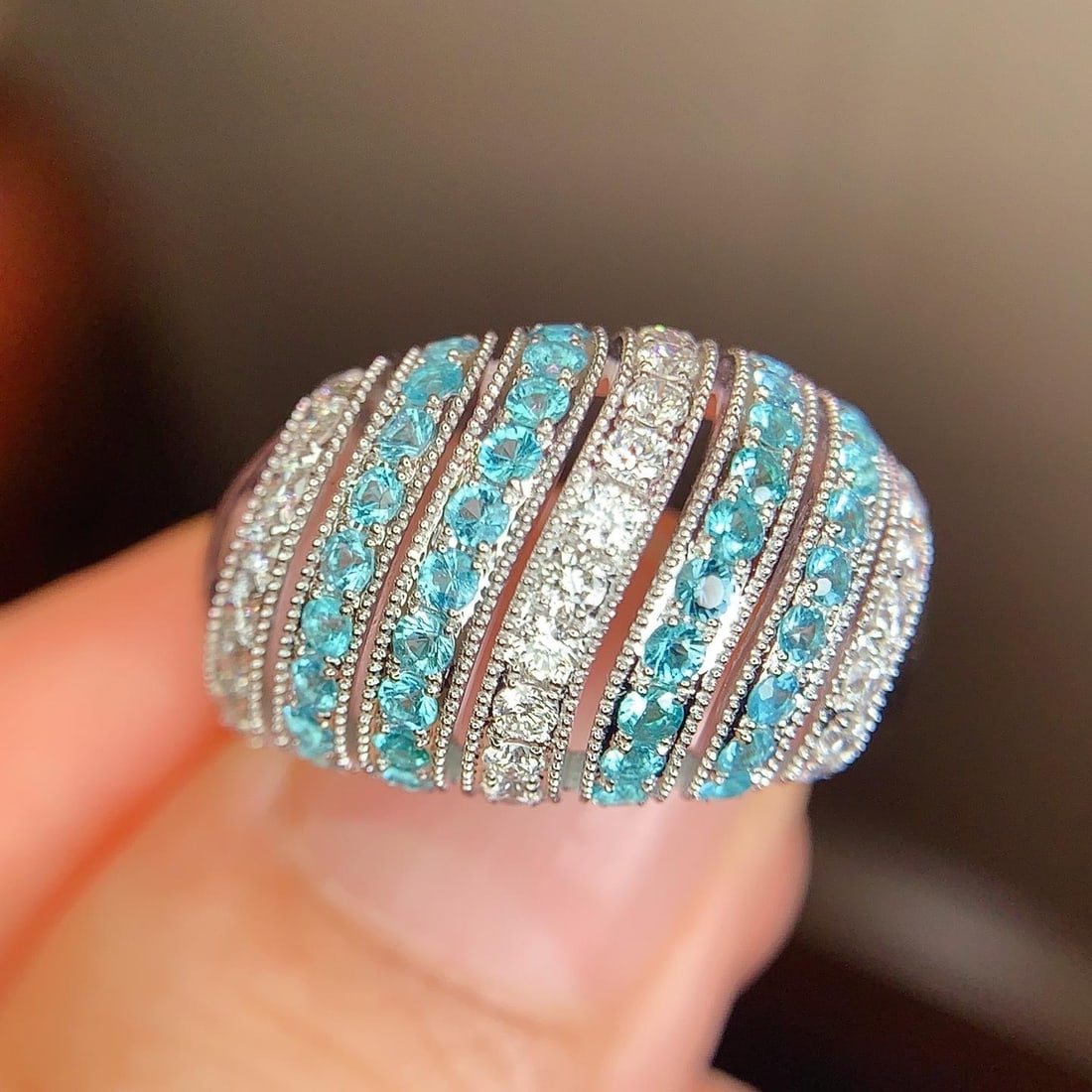 14k Gold 1.21 Ctw Natural Paraiba Tourmaline & Diamond Ring: Ref:231188020 // gold content:14k gold // ring size:7. 25us // // main gemstone:paraiba tourmaline // shape:round // carat weight:0. 7ct // color:blue // treatment:natural // cut grade:g // //