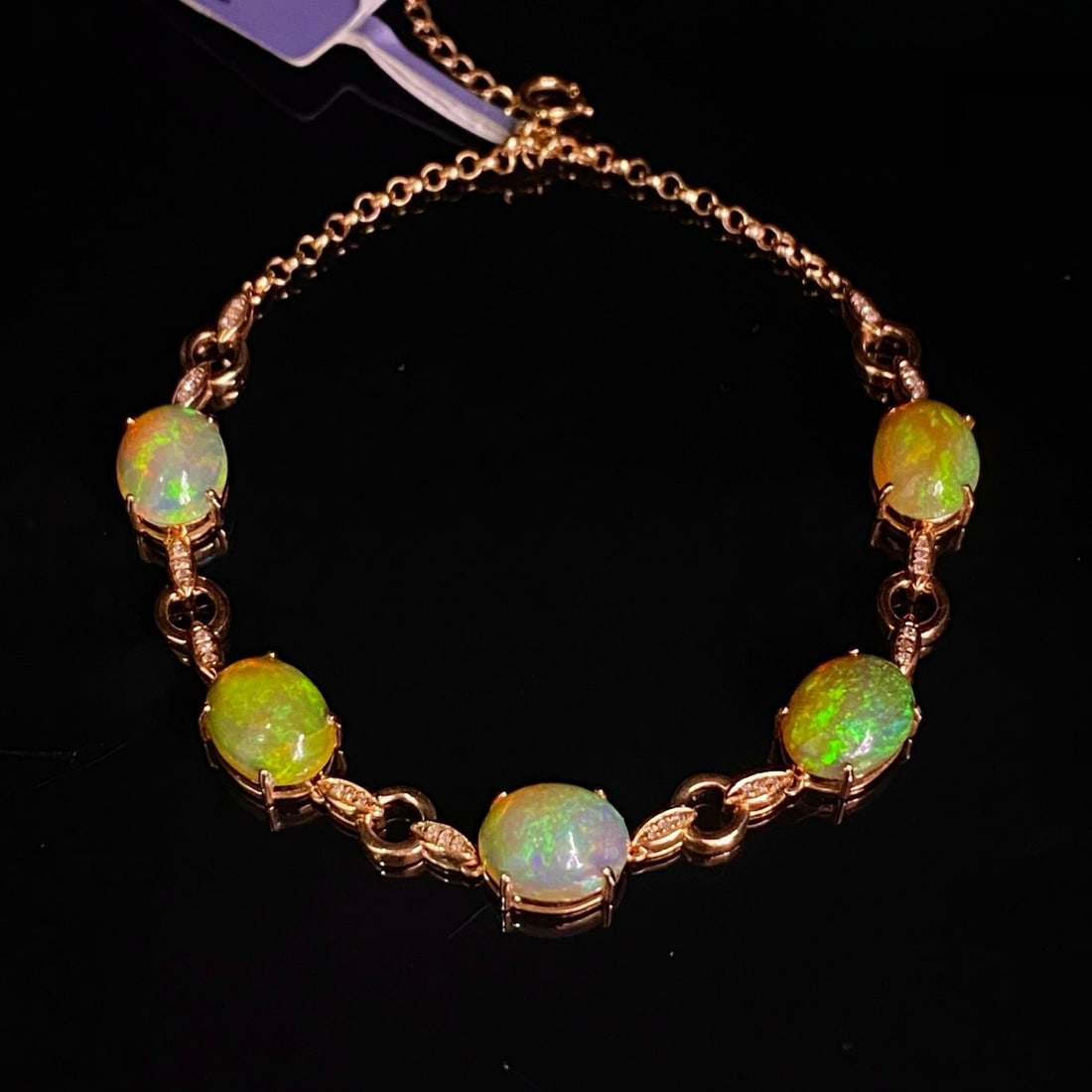 14k Gold 6.05 Ct Natural Opal & Diamond Bracelet: Ref:231188040 // gold content:14k gold // main gemstone:opal // shape:oval // carat weight:6. 05ct // color:color // treatment:natural // // adjacent gemstone 2 : diamond // number of stones:36 // sha