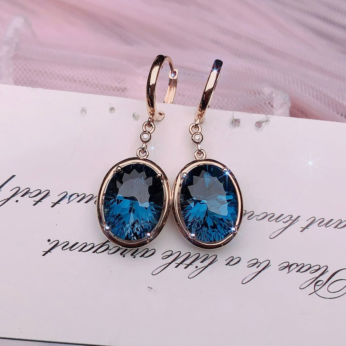14k Gold 4.55 Ctw Natural Topaz & Diamond Earrings: Ref:231188053 // gold content:14k gold // main gemstone:topaz // shape:oval // carat weight:4. 54ct // color:blue // treatment:natural // // adjacent gemstone 2 : diamond // number of stones:2 // shap