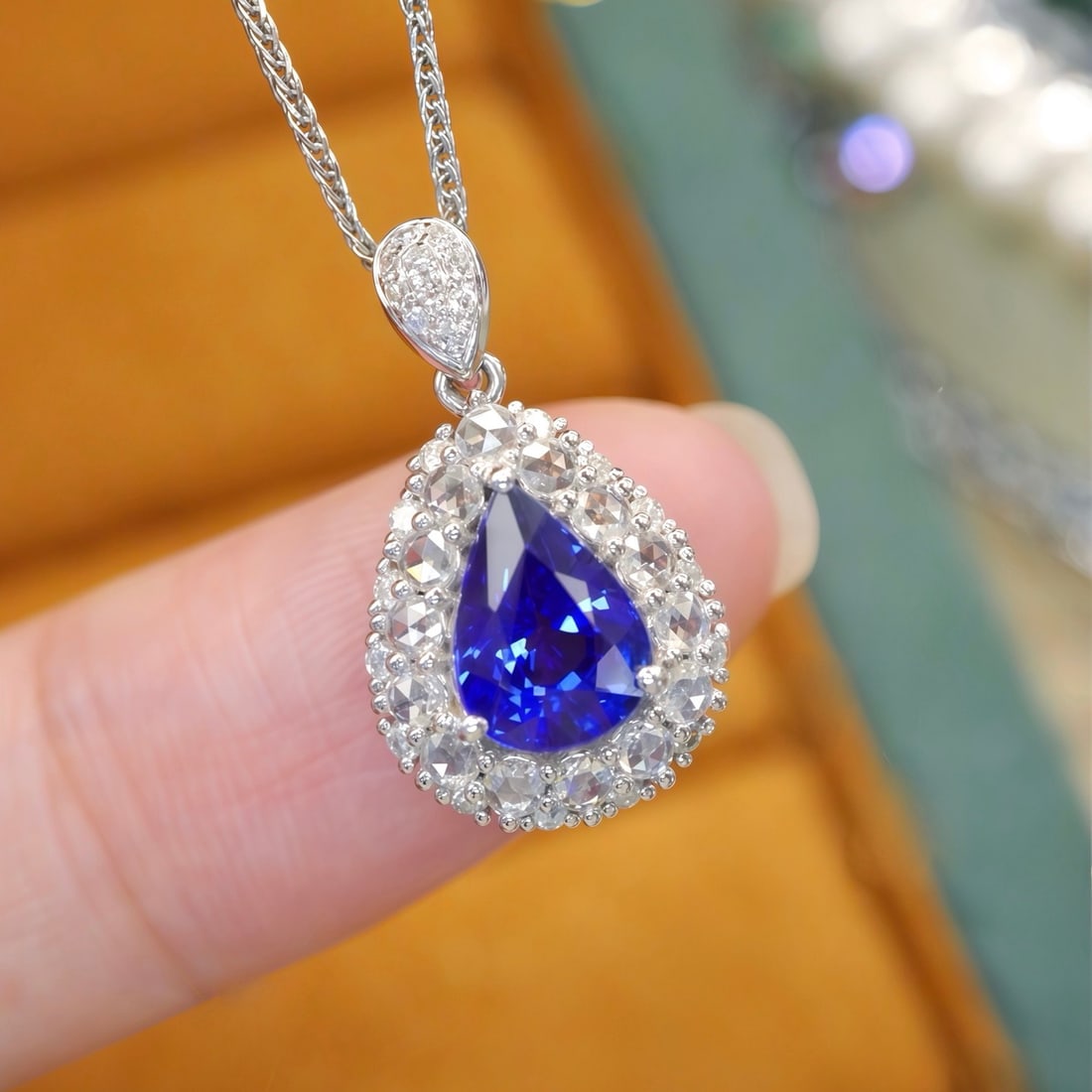 14k Gold 1.80 Ctw Natural Sapphire & Diamond Pendant( Without Chain ): Ref:231188120 // gold content:14k gold // main gemstone:sapphire // shape:pear // carat weight:1. 44ct // color:blue // treatment:natural // // adjacent gemstone 2 : diamond // number of stones:38 // 