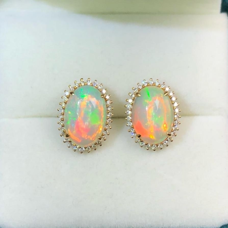14k Gold 3.0 Ct Natural Opal & Diamond Earrings: Ref:231188131 // gold content:14k gold // main gemstone:opal // shape:oval // carat weight:3. 0ct // color:white // treatment:natural // // adjacent gemstone 2 : diamond // shape:round // clarity