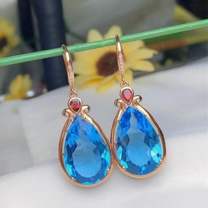 14k Gold 22.6 Ct Natural Topaz & Diamond Earrings: Ref:231188145 // gold content:14k gold // main gemstone:topaz // shape:pear // carat weight:22. 6ct // color:blue // treatment:natural // // adjacent gemstone 2 : diamond // number of stones:10 //