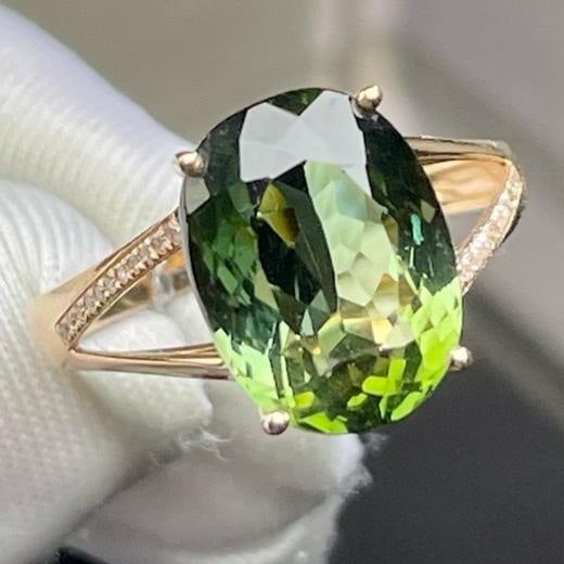 14k Gold 6.25 Ct Natural Tourmaline & Diamond Ring: Ref:231188201 // gold content:14k gold // ring size:7. 25us // // main gemstone:tourmaline // shape:oval // carat weight:6. 25ct // color:green // treatment:natural // // adjacent gemstone 2 :
