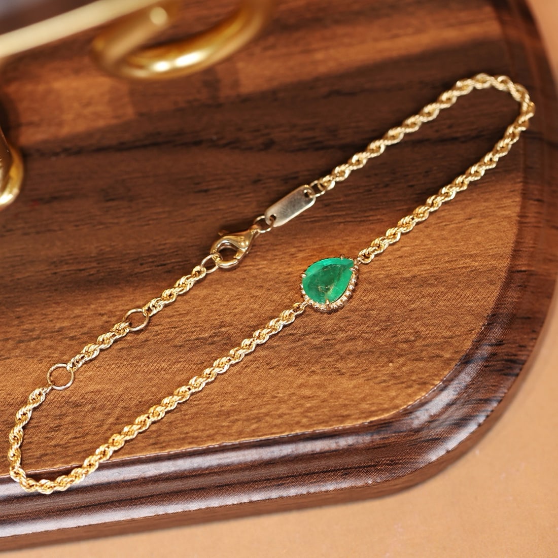 14k Gold 0.6 Ct Natural Emerald Bracelet: Ref:231188219 // gold content:14k gold // main gemstone:emerald // shape:pear // carat weight:0. 6ct // color:green // treatment:natural // Condition: New Low Estimate: 2400.00 High Estimate: 3600.00