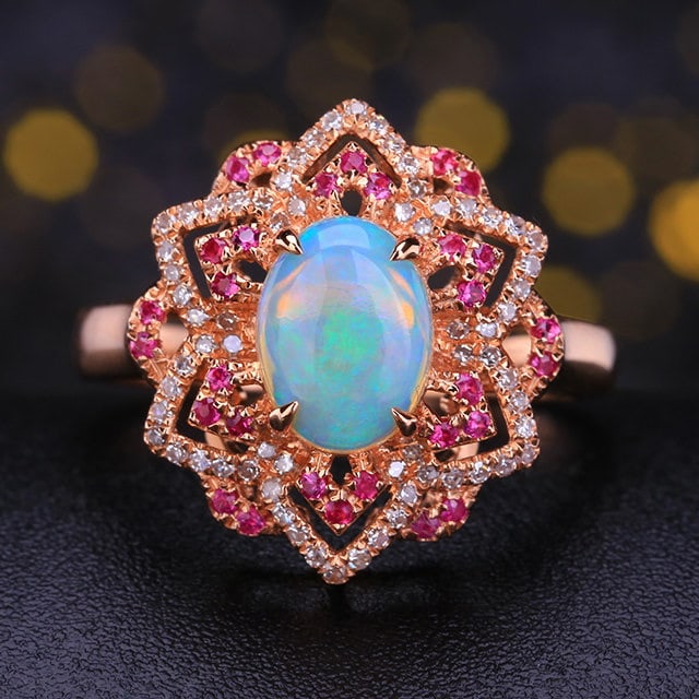 14k Gold 1.13 Ctw Natural Opal & Diamond Ring: Ref:231188220 // gold content:14k gold // ring size:7. 25us // // main gemstone:opal // shape:oval // carat weight:0. 93ct // color:white // treatment:natural // // adjacent gemstone 2 : diamond //