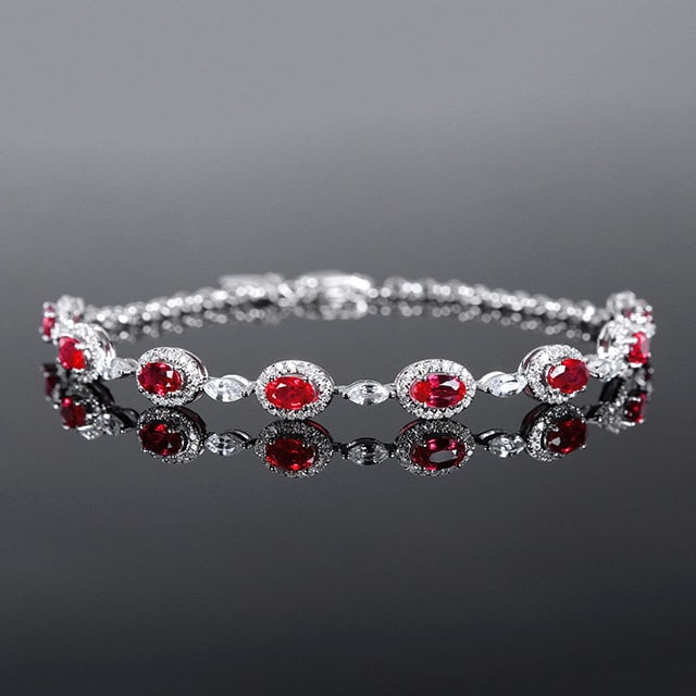14k Gold 2.48 Ctw Natural Ruby & Diamond Bracelet: Ref:231188257 // gold content:14k gold // main gemstone:ruby // shape:oval // carat weight:2. 05ct // color:red // treatment:natural // // adjacent gemstone 2 : diamond // number of stones:144 // shap