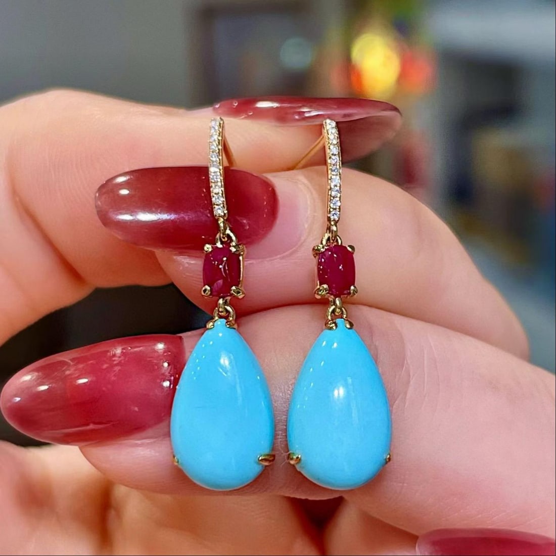 14k Gold 5.41 Ctw Natural Blue Turquoise & Ruby Earrings: Ref:231188423 // gold content:14k gold // main gemstone:blue turquoise // shape:pear // carat weight:4. 98ct // color:blue // treatment:natural // // adjacent gemstone 2 : ruby // shape:sugar-loaf //