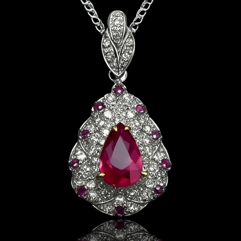 14k Gold 1.16 Ctw Natural Ruby & Sapphire Pendant( Without Chain ): Ref:231189031 // gold content:14k gold // main gemstone:ruby // shape:pear // carat weight:1. 01ct // color:red // treatment:natural // // adjacent gemstone 2 : sapphire // shape:round // carat