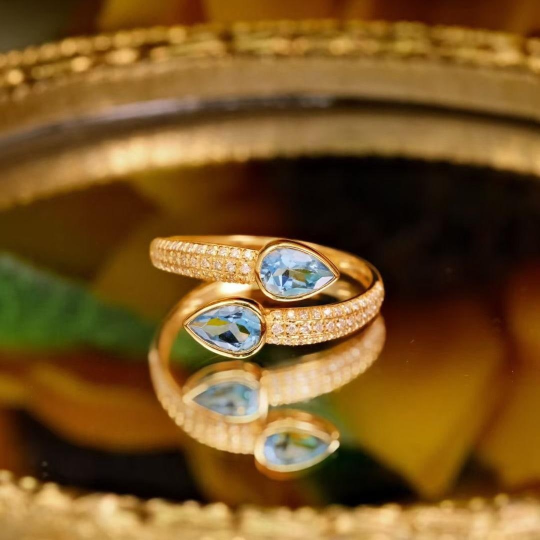 14k Gold 1.04 Ctw Natural Aquamarine & Diamond Ring: Ref:231189240 // gold content:14k gold // ring size:7. 25us // // main gemstone:aquamarine // shape:pear // carat weight:0. 8ct // color:blue // treatment:natural // // adjacent gemstone 2 : diamond