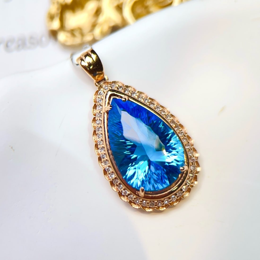 14k Gold 6.8 Ct Natural Topaz & Diamond Pendant( Without Chain ): Ref:231189250 // gold content:14k gold // main gemstone:topaz // shape:pear // carat weight:6. 8ct // color:blue // treatment:natural // // adjacent gemstone 2 : diamond // number of stones:46 // shap