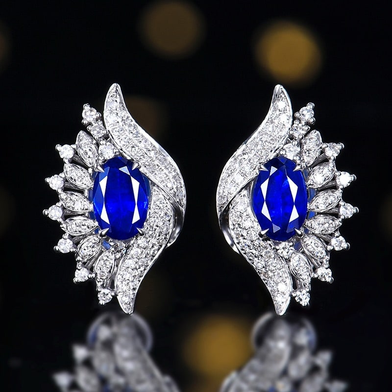 14k Gold 1.10 Ctw Vivid Blue Natural Sapphire & Diamond Earrings: Ref:231190033 // gold content:14k gold // main gemstone:sapphire // shape:oval // carat weight:0. 81ct // color:vivid blue // treatment:natural // // adjacent gemstone 2 : diamond // number of stones: