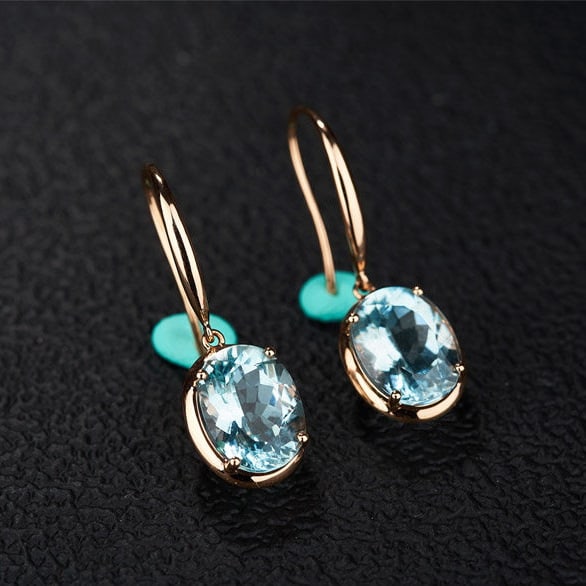 14k Gold 3.76 Ct Natural Aquamarine Earrings: Ref:231190057 // gold content:14k gold // main gemstone:aquamarine // shape:oval // carat weight:3. 76ct // color:blue // treatment:natural // Condition: New Low Estimate: 2900.00 High Estimate: