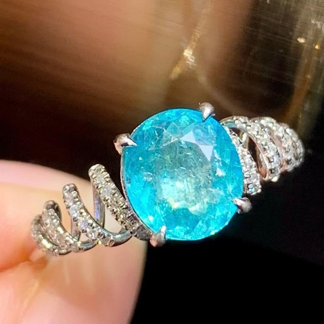 14k Gold 1.6 Ct Natural Paraiba Tourmaline & Diamond Ring: Ref:231190064 // gold content:14k gold // ring size:7. 25us // // main gemstone:paraiba tourmaline // shape:oval // carat weight:1. 6ct // color:blue // treatment:natural // // adjacent gemstone 2 :