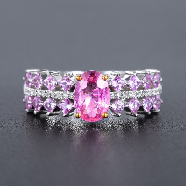 14k Gold 1.43 Ctw Natural Padparadscha Sapphire & Sapphire Ring: Ref:231190072 // gold content:14k gold // ring size:7. 25us // // main gemstone:padparadscha sapphire // shape:oval // carat weight:0. 85ct // color:orangish pink // treatment:natural // // adjacent