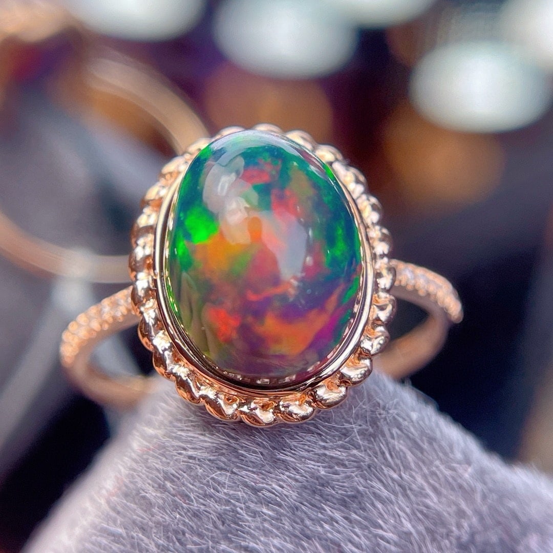 14k Gold 3.9 Ct Natural Opal & Diamond Ring: Ref:231190082 // gold content:14k gold // ring size:7. 25us // // main gemstone:opal // shape:oval // carat weight:3. 9ct // color:color // treatment:natural // // adjacent gemstone 2 : diamond //