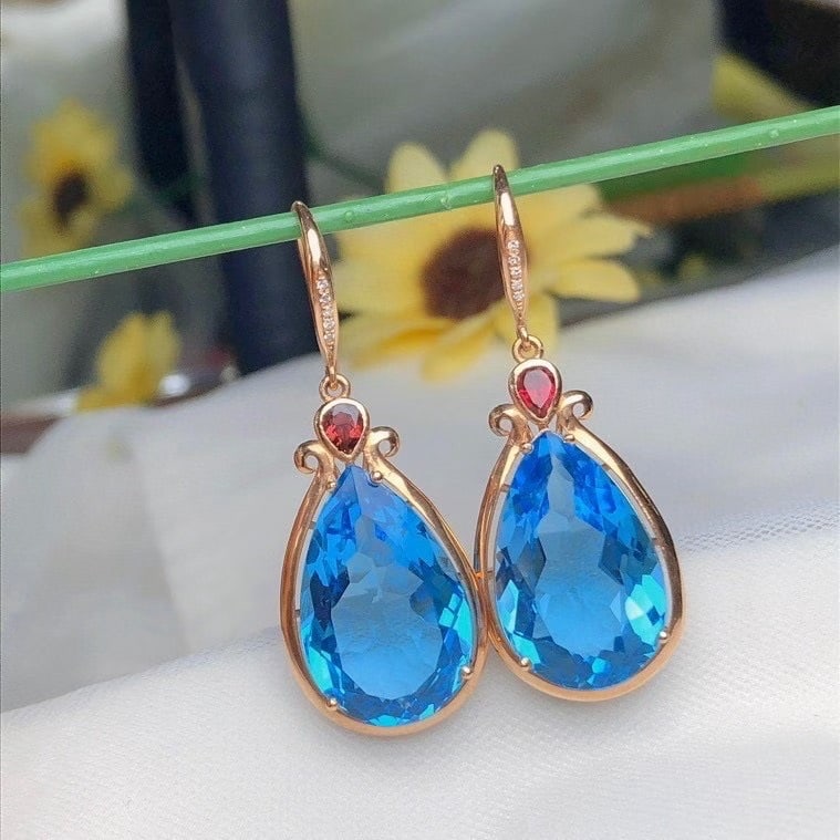 14k Gold 22.6 Ct Natural Topaz & Diamond Earrings: Ref:231190096 // gold content:14k gold // main gemstone:topaz // shape:pear // carat weight:22. 6ct // color:blue // treatment:natural // // adjacent gemstone 2 : diamond // number of stones:10 // sha