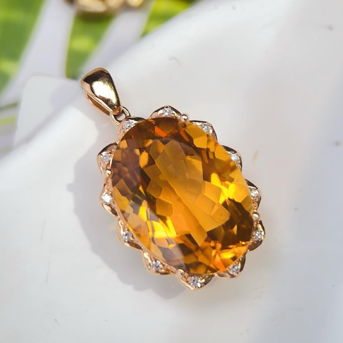 14k Gold 12.66 Ctw Natural Citrine & Diamond Pendant( Without Chain ): Ref:231190115 // gold content:14k gold // main gemstone:citrine // shape:oval // carat weight:12. 6ct // color:yellow // treatment:natural // // adjacent gemstone 2 : diamond // number of stones:12 //