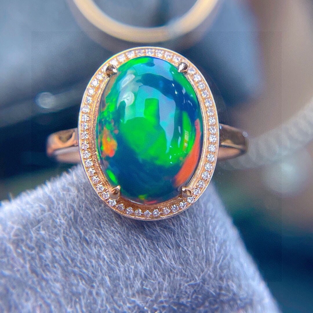 14k Gold 3.1 Ct Natural Opal & Diamond Ring: Ref:231190131 // gold content:14k gold // ring size:7. 25us // // main gemstone:opal // shape:oval // carat weight:3. 1ct // color:color // treatment:natural // // adjacent gemstone 2 : diamond // sha