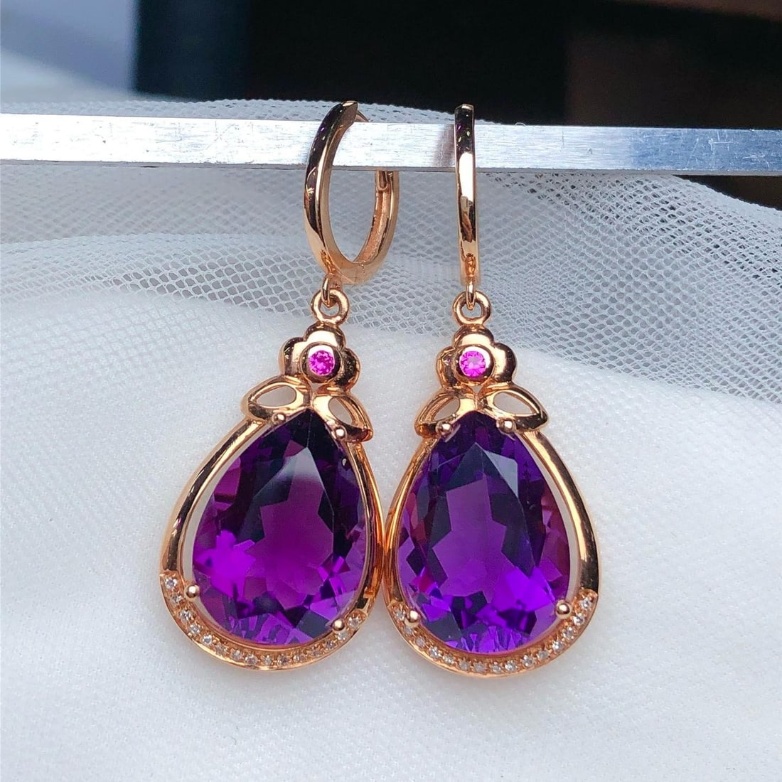 14k Gold 9.90 Ct Natural Amethyst & Diamond Earrings: Ref:231190160 // gold content:14k gold // main gemstone:amethyst // shape:pear // carat weight:9. 90ct // color:purple // treatment:natural // // adjacent gemstone 2 : diamond // number of stones:30