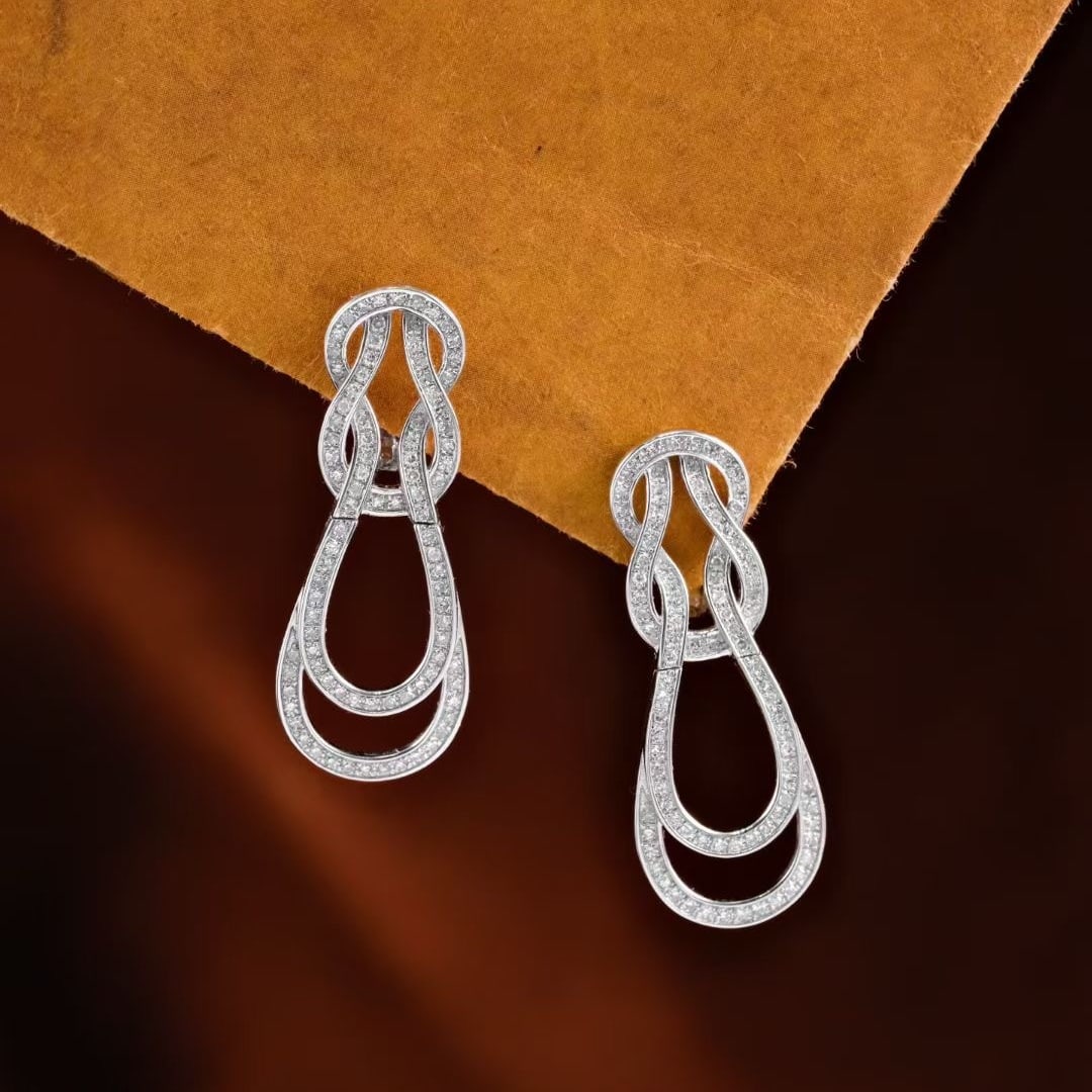 14k Gold 0.56 Ct Natural H Diamond Earrings: Ref:231190187 // gold content:14k gold // main gemstone:diamond // shape:round // carat weight:0. 56ct // clarity grade:vs-si // color:h // treatment:natural // cut grade:g // Condition: New Low Estim