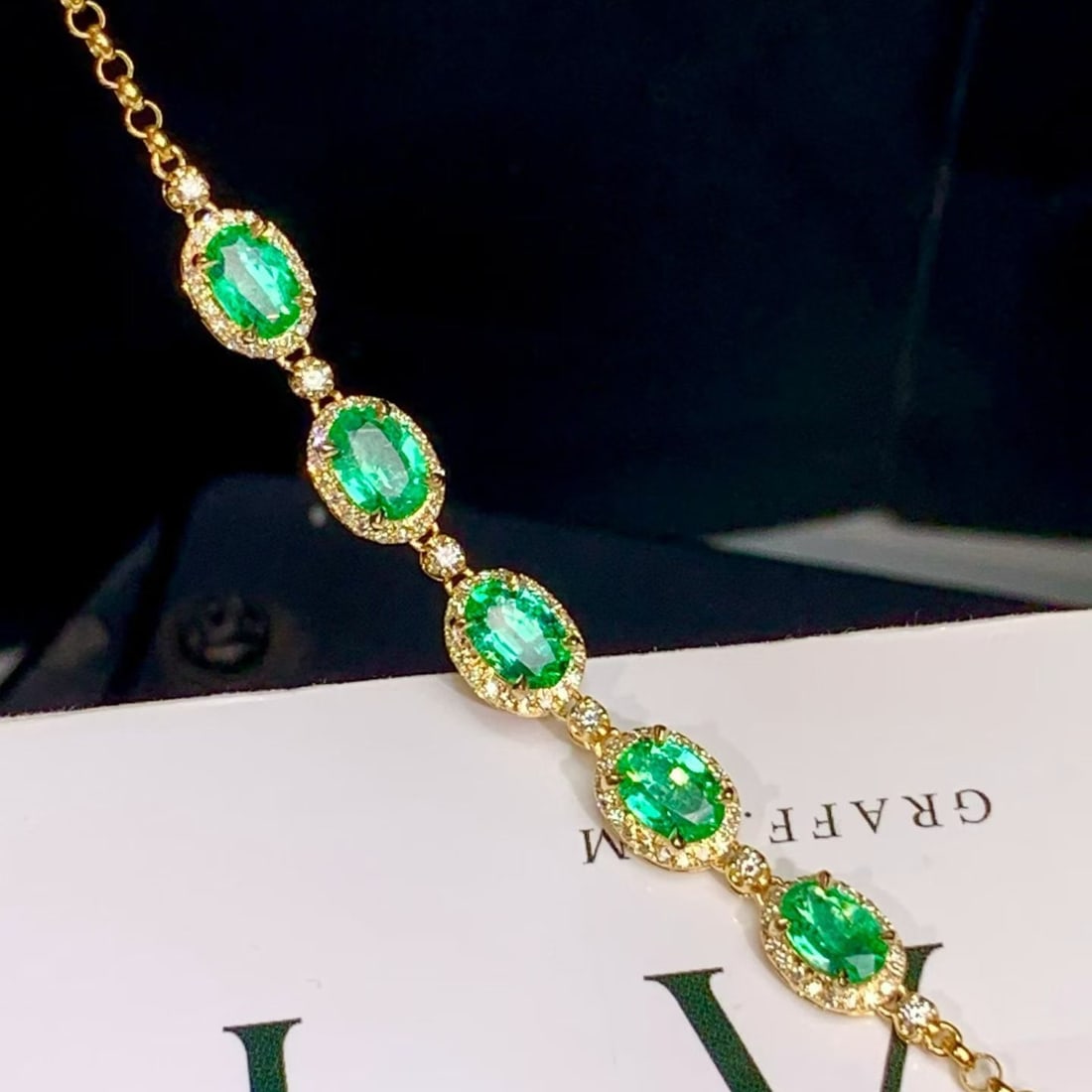 14k Gold 2.14 Ctw Natural Emerald & Diamond Bracelet: Ref:231190305 // gold content:14k gold // main gemstone:emerald // shape:oval // carat weight:1. 8ct // color:green // treatment:natural // // adjacent gemstone 2 : diamond // shape:round // carat wei