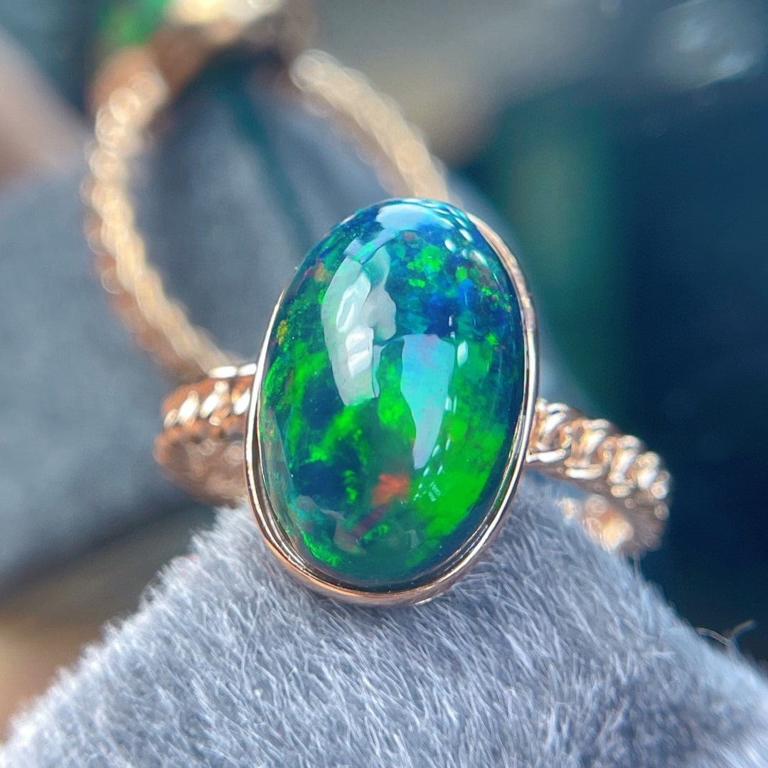 14k Gold 4.8 Ct Natural Opal Ring: Ref:231190320 // gold content:14k gold // ring size:7. 25us // // main gemstone:opal // shape:oval // carat weight:4. 8ct // color:color // treatment:natural // Condition: New Low Estimate: 1800.00