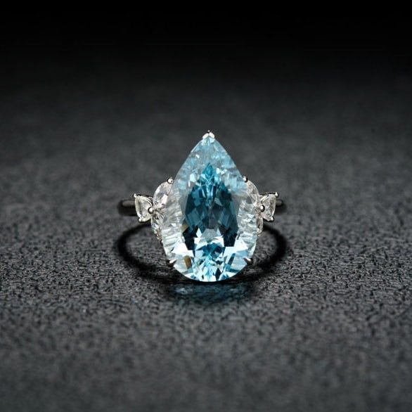 14k Gold 6.63 Ctw Natural Aquamarine & Sapphire Ring: Ref:231190340 // gold content:14k gold // ring size:7. 25us // // main gemstone:aquamarine // shape:pear // carat weight:6. 21ct // color:blue // treatment:natural // // adjacent gemstone 2 :