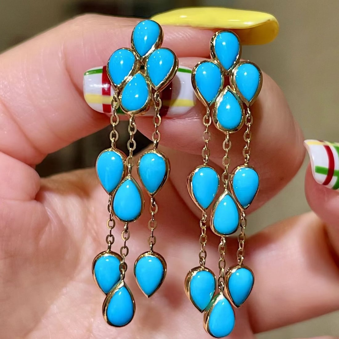14k Gold 8.0 Ct Natural Blue Turquoise Earrings: Ref:231190341 // gold content:14k gold // main gemstone:blue turquoise // shape:pear // carat weight:8. 0ct // color:blue // treatment:natural // Condition: New Low Estimate: 5700.00 High Estimate: