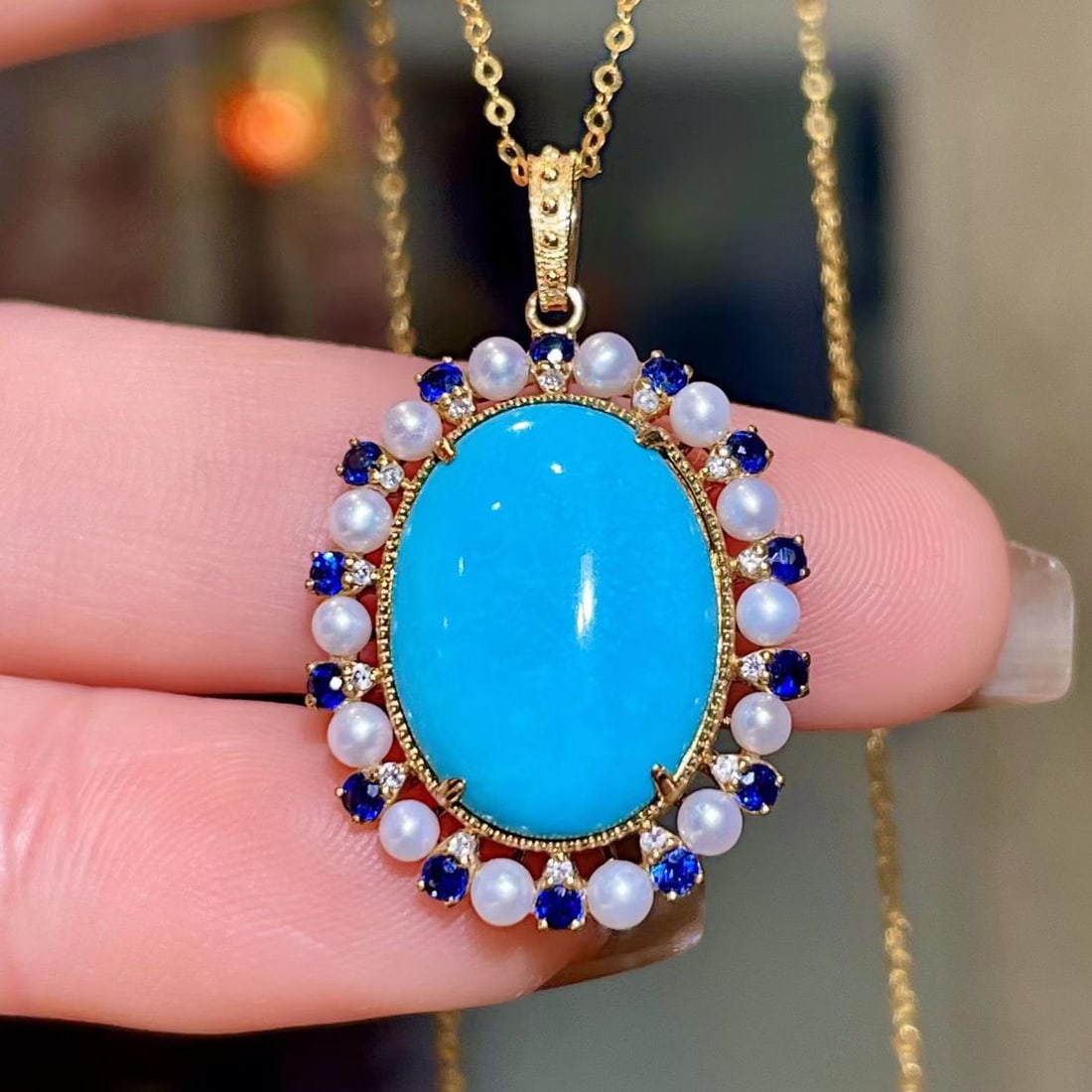 14k Gold 6.80 Ctw Natural Blue Turquoise & Sapphire Pendant( Without Chain ): Ref:231190345 // gold content:14k gold // main gemstone:blue turquoise // shape:oval // carat weight:6. 43ct // color:blue // treatment:natural // // adjacent gemstone 2 : sapphire // shape:round //
