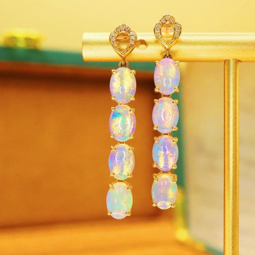 14k Gold 3.41 Ctw Natural Opal & Diamond Earrings: Ref:231190415 // gold content:14k gold // main gemstone:opal // shape:oval // carat weight:3. 36ct // color:white // treatment:natural // // adjacent gemstone 2 : diamond // number of stones:18 //