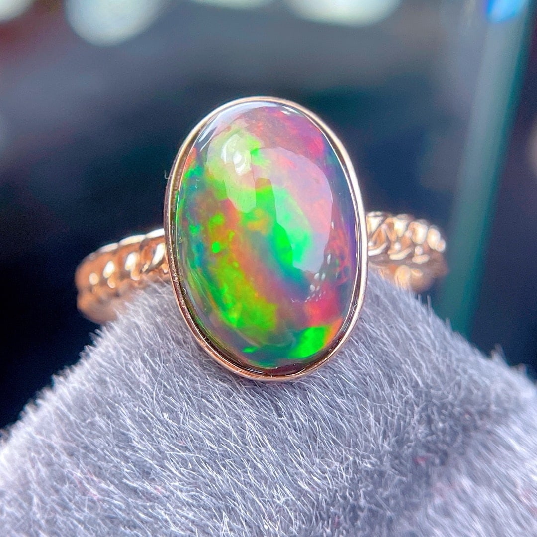14k Gold 3.7 Ct Natural Opal Ring: Ref:231190416 // gold content:14k gold // ring size:7. 25us // // main gemstone:opal // shape:oval // carat weight:3. 7ct // color:color // treatment:natural // Condition: New Low Estimate: 1700.00