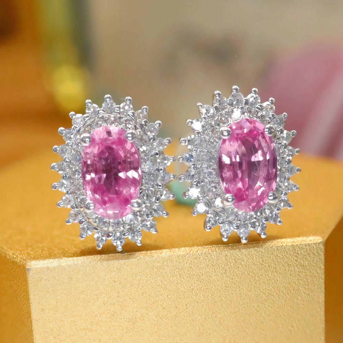 14k Gold 1.33 Ctw Natural Padparadscha Sapphire & Diamond Earrings: Ref:231108031 // gold content:14k gold // main gemstone:padparadscha sapphire // shape:oval // carat weight:1. 00ct // color:orangish pink // treatment:natural // // adjacent gemstone 2 : diamond //
