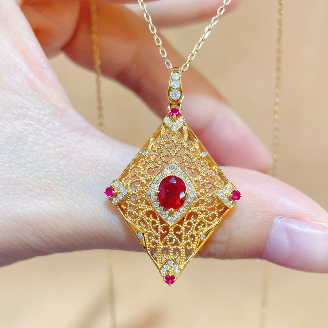14k Gold 1.08 Ctw Natural Ruby & Diamond Pendant( Without Chain ): Ref:231108449 // gold content:14k gold // main gemstone:ruby // shape:oval // carat weight:0. 83ct // color:red // treatment:natural // // adjacent gemstone 2 : diamond // shape:round // carat