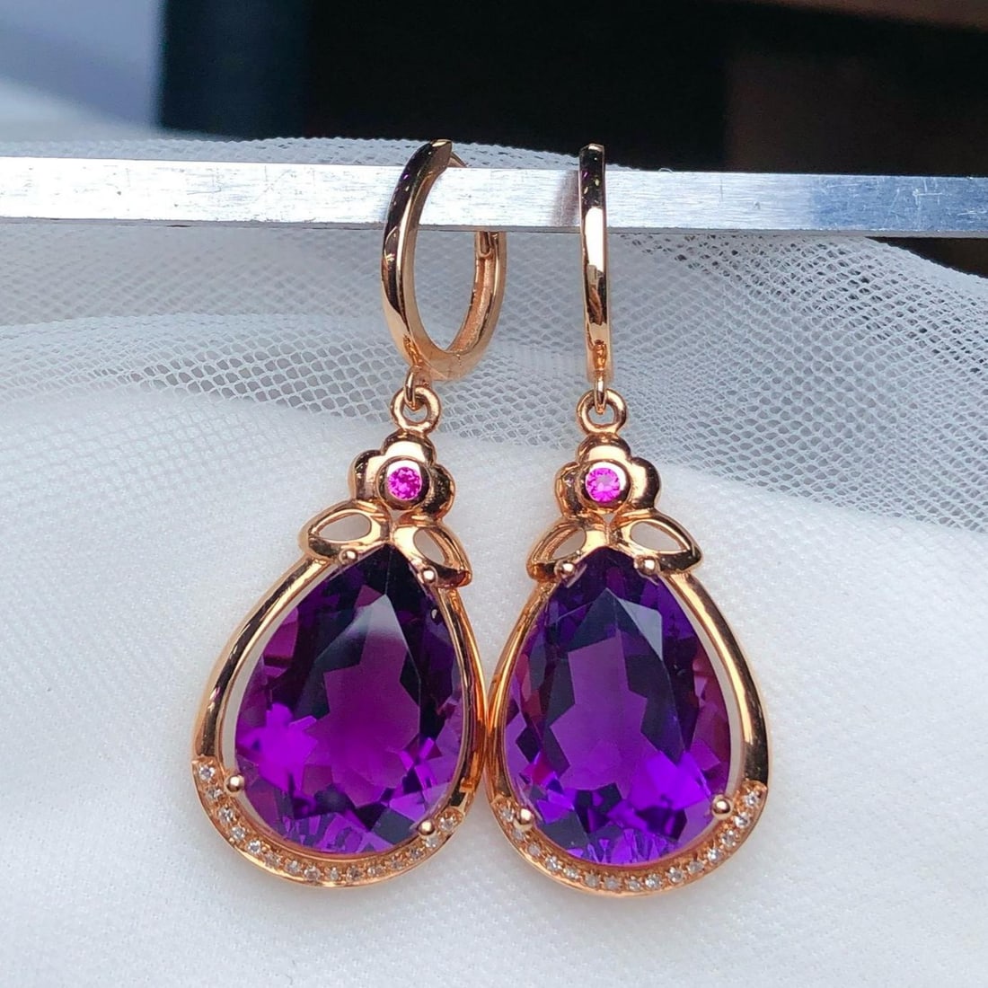 14k Gold 9.90 Ct Natural Amethyst & Diamond Earrings: Ref:231191025 // gold content:14k gold // main gemstone:amethyst // shape:pear // carat weight:9. 90ct // color:purple // treatment:natural // // adjacent gemstone 2 : diamond // number of stones:30