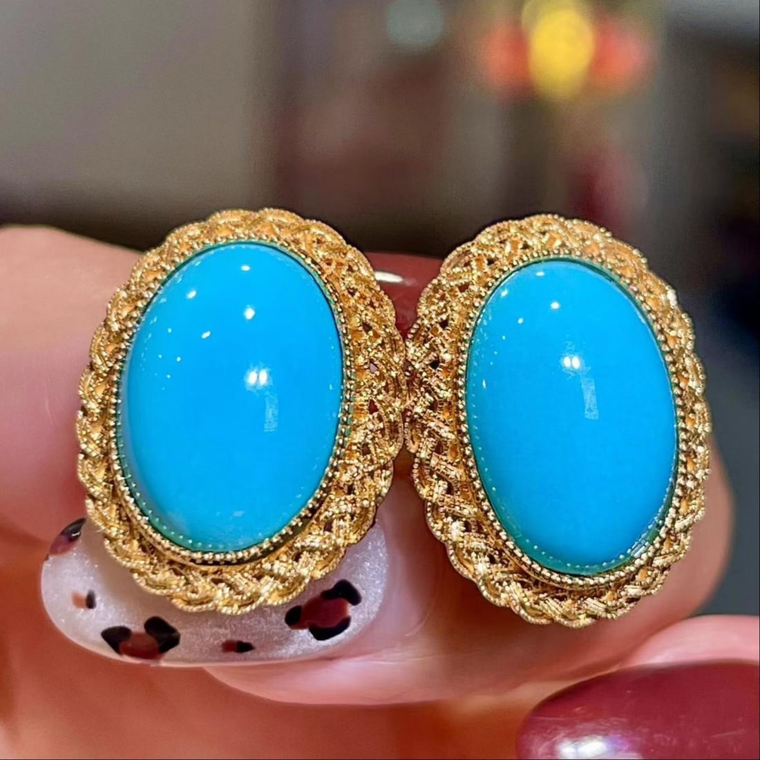 14k Gold 8.86 Ct Natural Blue Turquoise Earrings: Ref:231191202 // gold content:14k gold // main gemstone:blue turquoise // shape:oval // carat weight:8. 86ct // color:blue // treatment:natural // Condition: New Low Estimate: 6600.00 High Estimate: