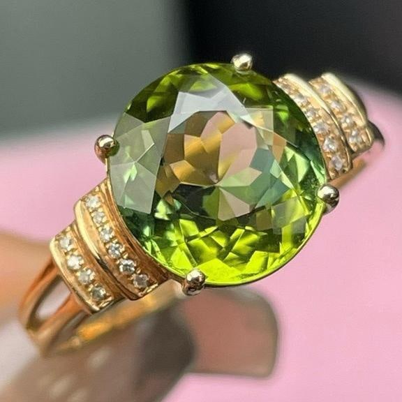 14k Gold 3 Ct Natural Tourmaline & Diamond Ring: Ref:231191206 // gold content:14k gold // ring size:7. 25us // // main gemstone:tourmaline // shape:oval // carat weight:3ct // color:green // treatment:natural // // adjacent gemstone 2 : diamond // 