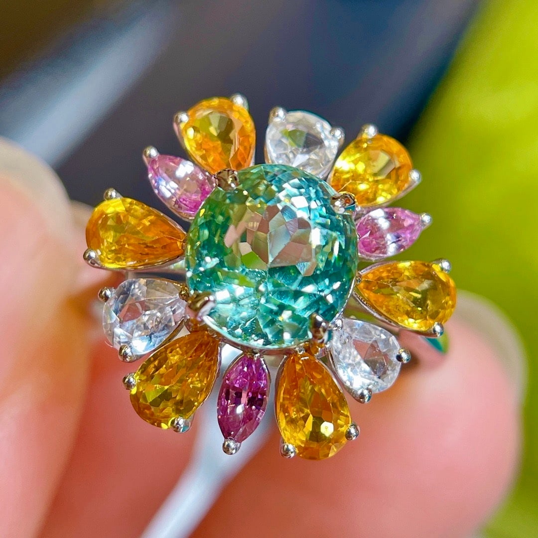 14k Gold 4.62 Ctw Natural Tourmaline & Sapphire Ring: Ref:231192251 // gold content:14k gold // ring size:7. 25us // // main gemstone:tourmaline // shape:oval // carat weight:2. 34ct // color:green // treatment:natural // // adjacent gemstone 2 : sapphir