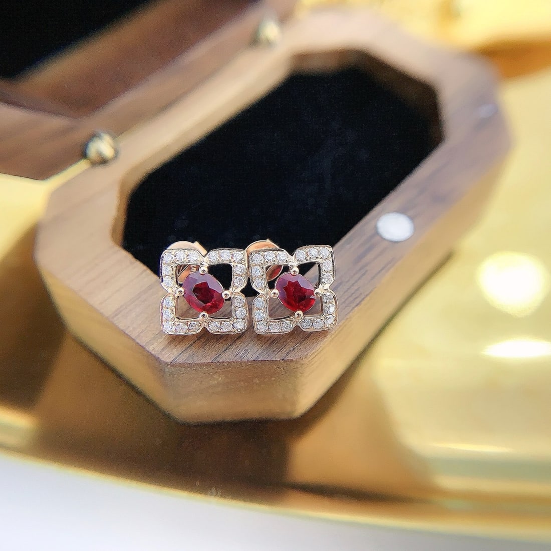 14k Gold 0.82 Ctw Natural Ruby & Diamond Earrings: Ref:231192372 // gold content:14k gold // main gemstone:ruby // shape:oval // carat weight:0. 58ct // color:red // treatment:natural // // adjacent gemstone 2 : diamond // shape:round // carat weight: