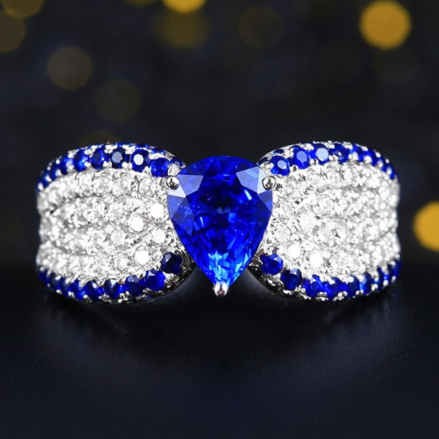 14k Gold 1.87 Ctw Natural Sapphire & Sapphire Ring: Ref:231192401 // gold content:14k gold // ring size:7. 25us // // main gemstone:sapphire // shape:pear // carat weight:1. 35ct // color:blue // treatment:natural // // adjacent gemstone 2 : sapphire /